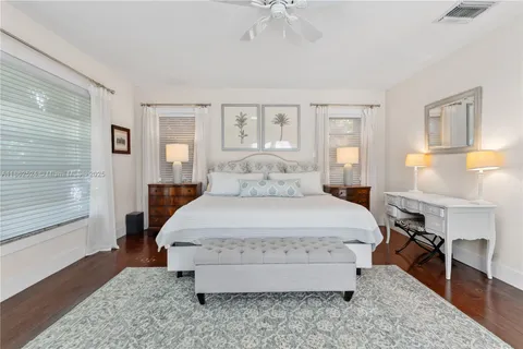 a spacious bedroom with a bed and a couch