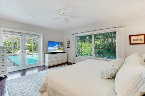 a bedroom with a bed and a table