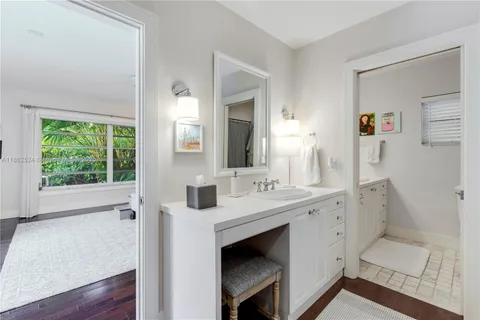a bathroom with a sink double vanity and a mirror