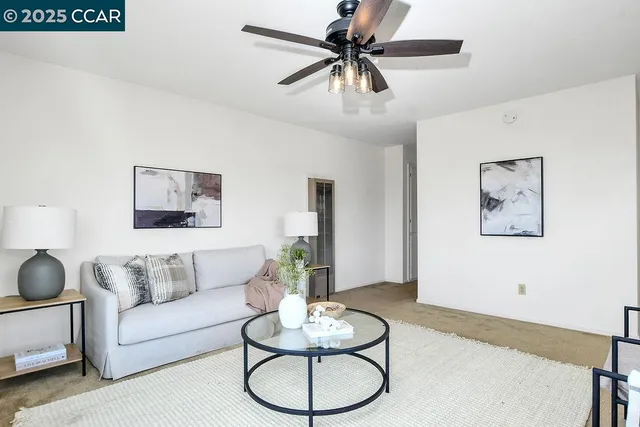 a kitchen with stainless steel appliances granite countertop a white cabinets and a stove