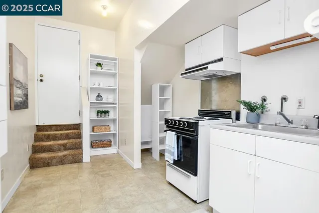 a kitchen with cabinets and appliances