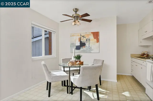 a dining room with furniture and window