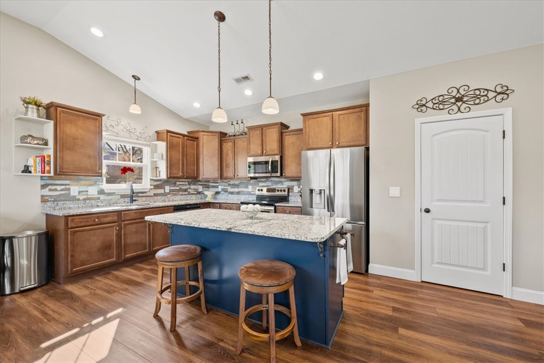 104 Inlet Pointe Drive Anderson, SC 29625 - Photo 11 of 50 This modern kitchen features a spacious island and contemporary finishes perfect for culinary adventures.