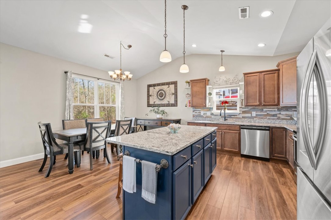 104 Inlet Pointe Drive Anderson, SC 29625 - Photo 50 of 50 This kitchen and dining area features an open floorplan with durable flooring and ample natural light.