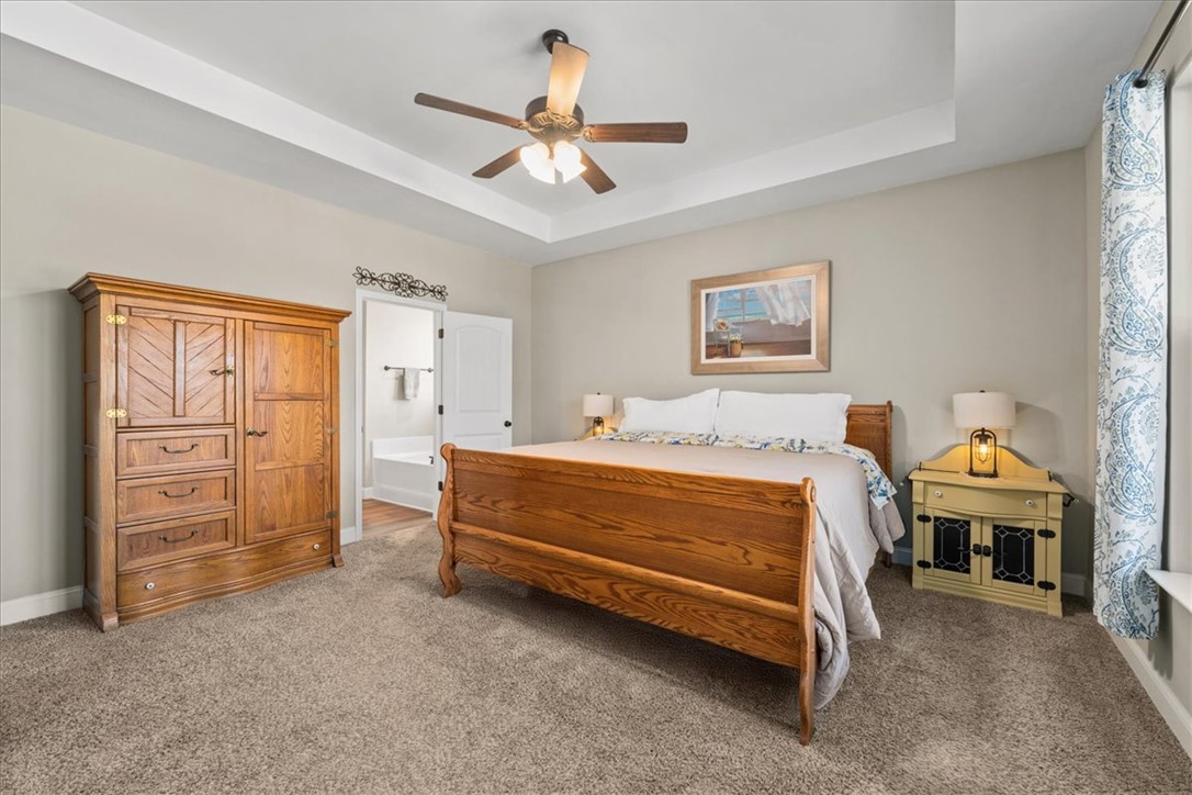 104 Inlet Pointe Drive Anderson, SC 29625 - Photo 18 of 50 This spacious room features cozy carpeting and a high tray ceiling.