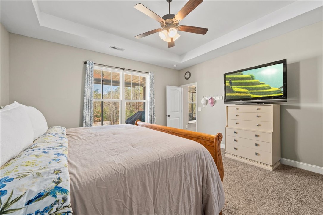 104 Inlet Pointe Drive Anderson, SC 29625 - Photo 19 of 50 This restful bedroom offers a spacious retreat with natural light and serene views.