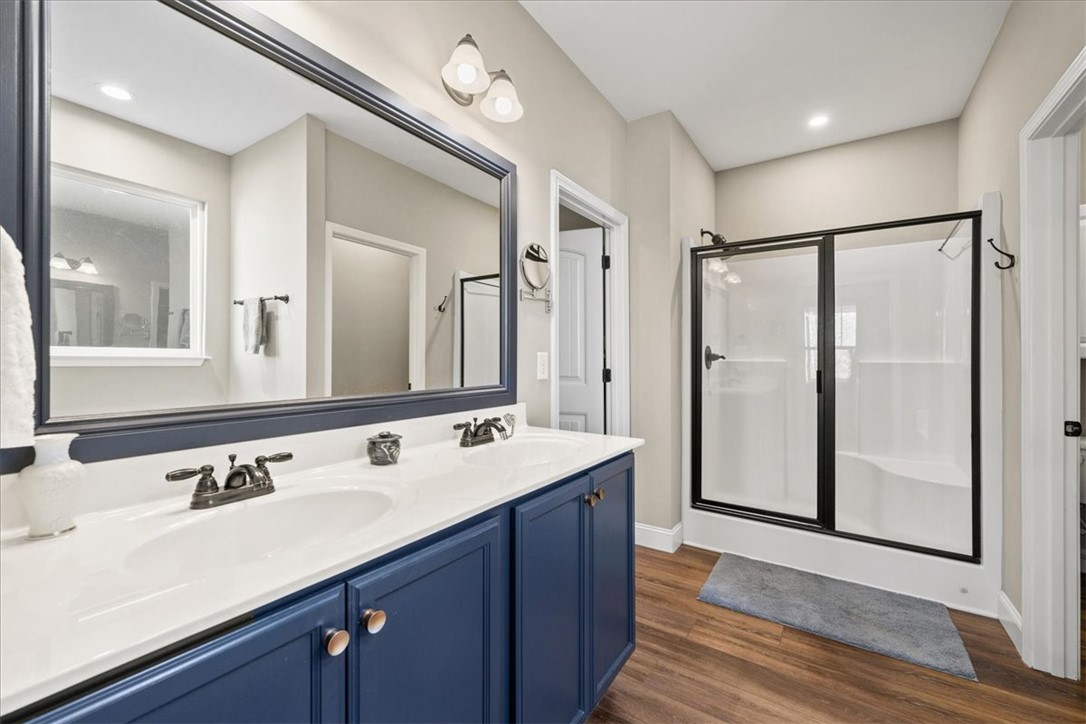 104 Inlet Pointe Drive Anderson, SC 29625 - Photo 21 of 50 This bathroom features a double vanity and a sleek shower for a modern appeal.