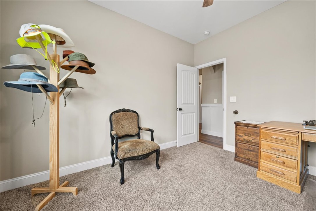 104 Inlet Pointe Drive Anderson, SC 29625 - Photo 26 of 50 This cozy room offers a tranquil retreat with soft carpet flooring and a neutral color palette.