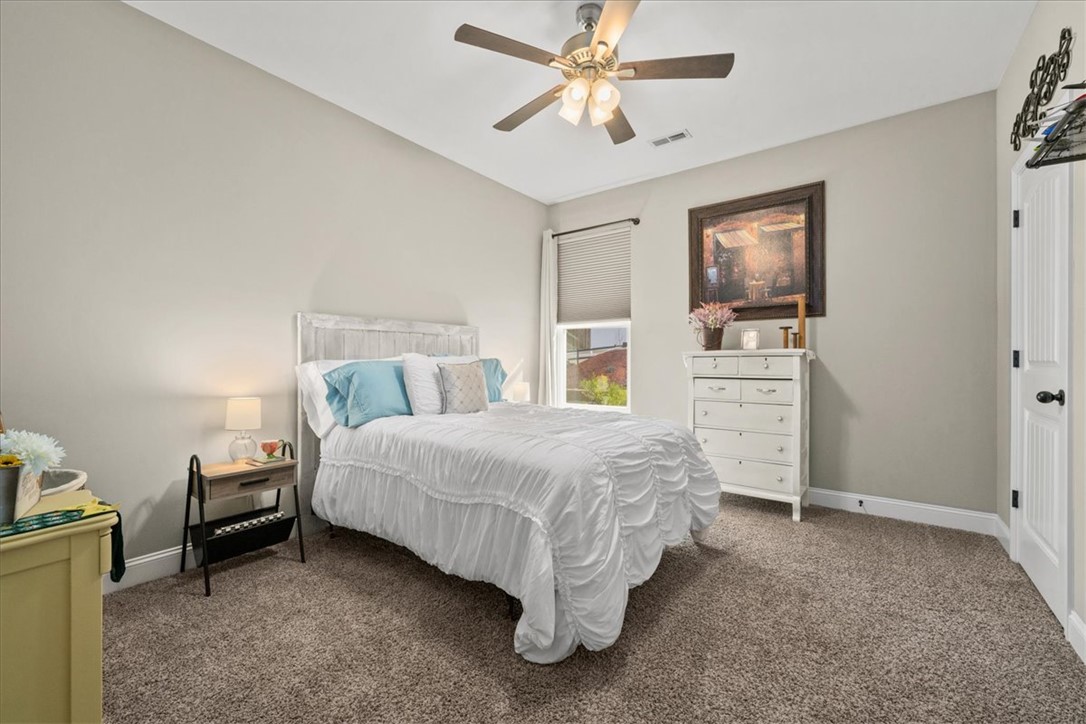 104 Inlet Pointe Drive Anderson, SC 29625 - Photo 28 of 50 This serene bedroom offers a comfortable retreat with soft carpet and a window for natural light.