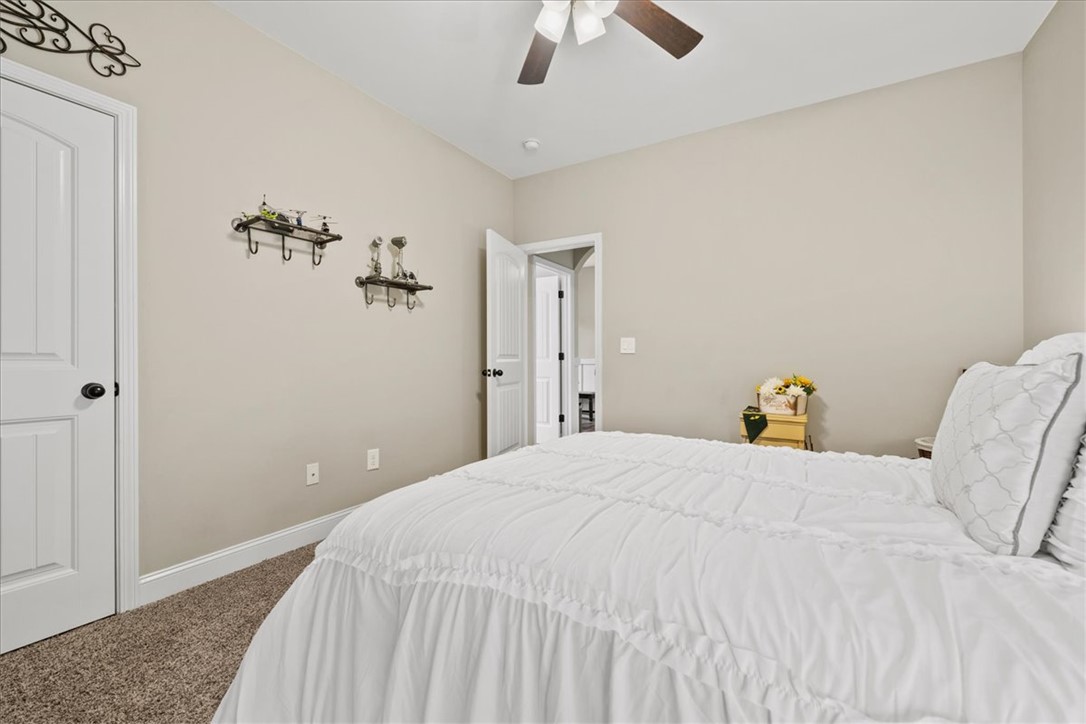 104 Inlet Pointe Drive Anderson, SC 29625 - Photo 29 of 50 This cozy bedroom features a neutral palette, plush carpeting, and a bright atmosphere.