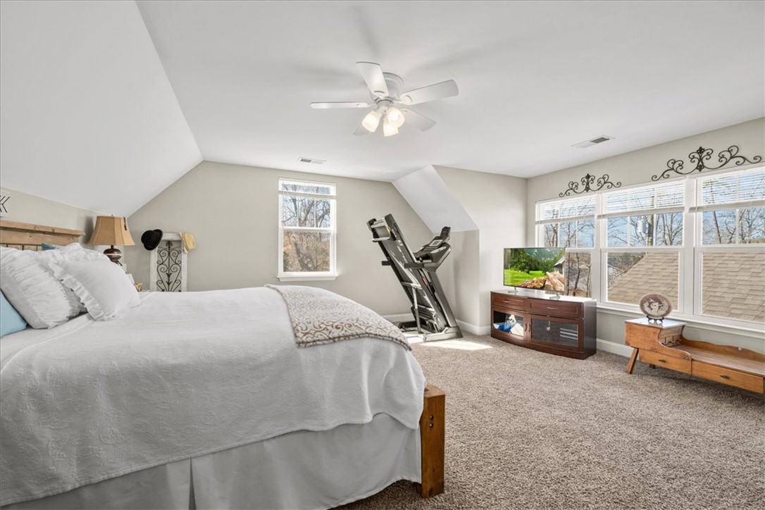 104 Inlet Pointe Drive Anderson, SC 29625 - Photo 34 of 50 This spacious bedroom offers ample natural light and a comfortable atmosphere for relaxation.