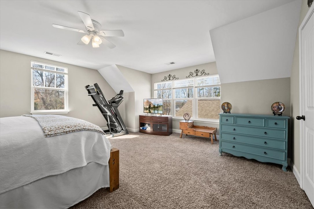 104 Inlet Pointe Drive Anderson, SC 29625 - Photo 37 of 50 This spacious bedroom offers ample natural light and a comfortable atmosphere for relaxation.