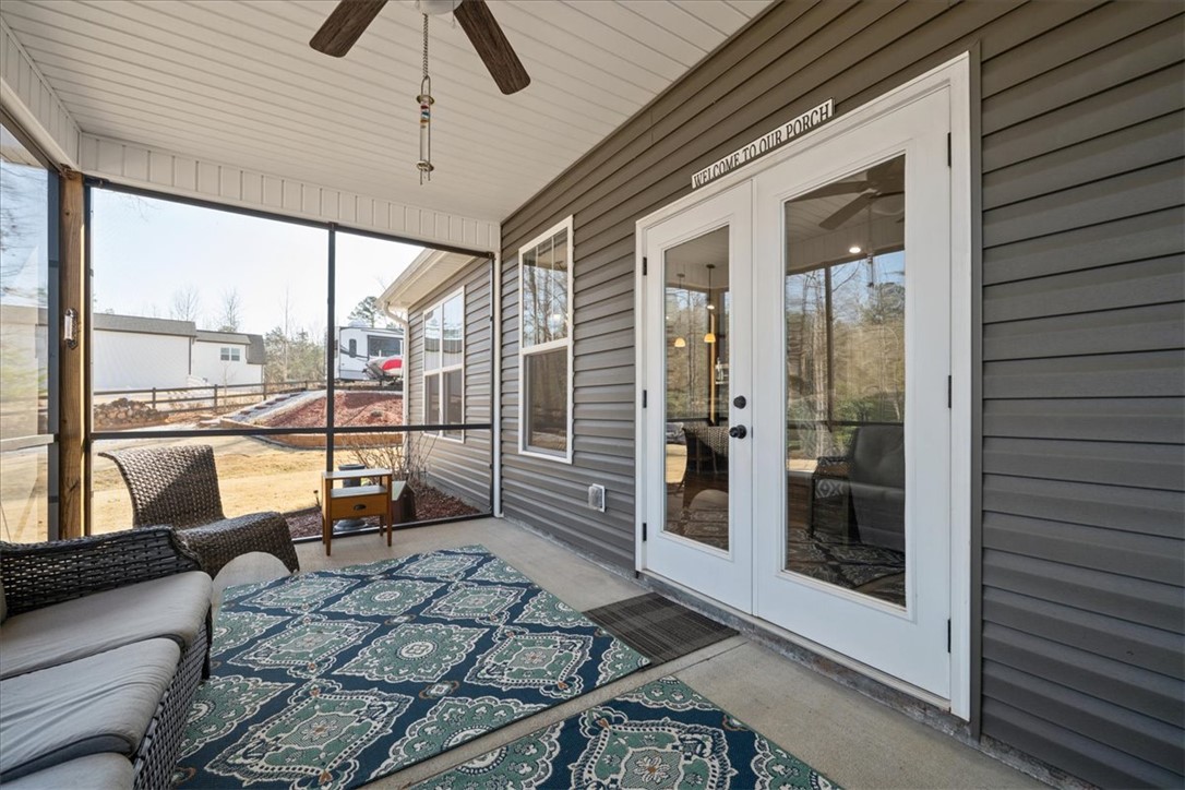 104 Inlet Pointe Drive Anderson, SC 29625 - Photo 41 of 50 This inviting porch area offers a tranquil retreat for relaxation and enjoying the outdoors.