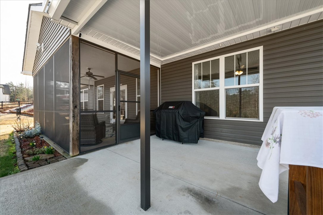 104 Inlet Pointe Drive Anderson, SC 29625 - Photo 43 of 50 This inviting patio area features a screened-in porch, perfect for enjoying outdoor moments.