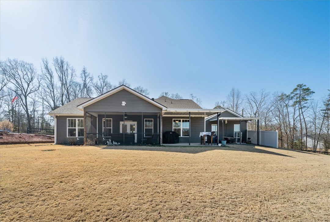 104 Inlet Pointe Drive Anderson, SC 29625 - Photo 48 of 50 This spacious property offers a serene outdoor living area, perfect for relaxation and gatherings.