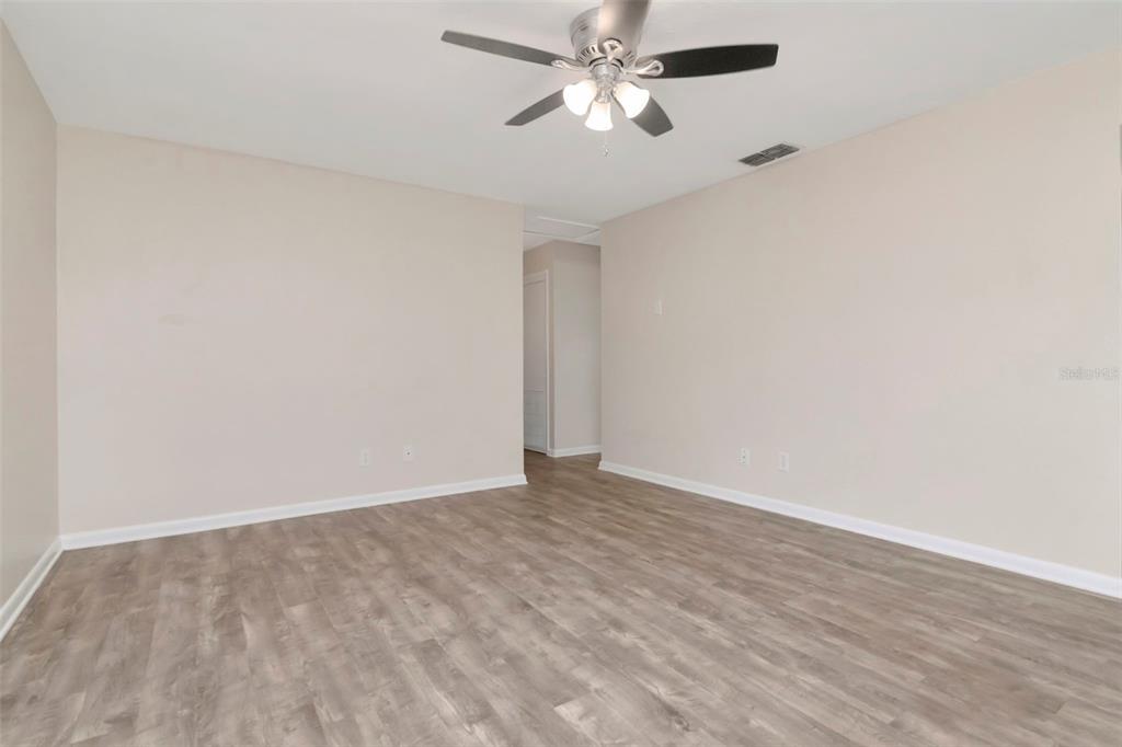 126 Kingsway Road Brandon, FL 33510 - Photo 13 of 42 a view of an empty room with a fan