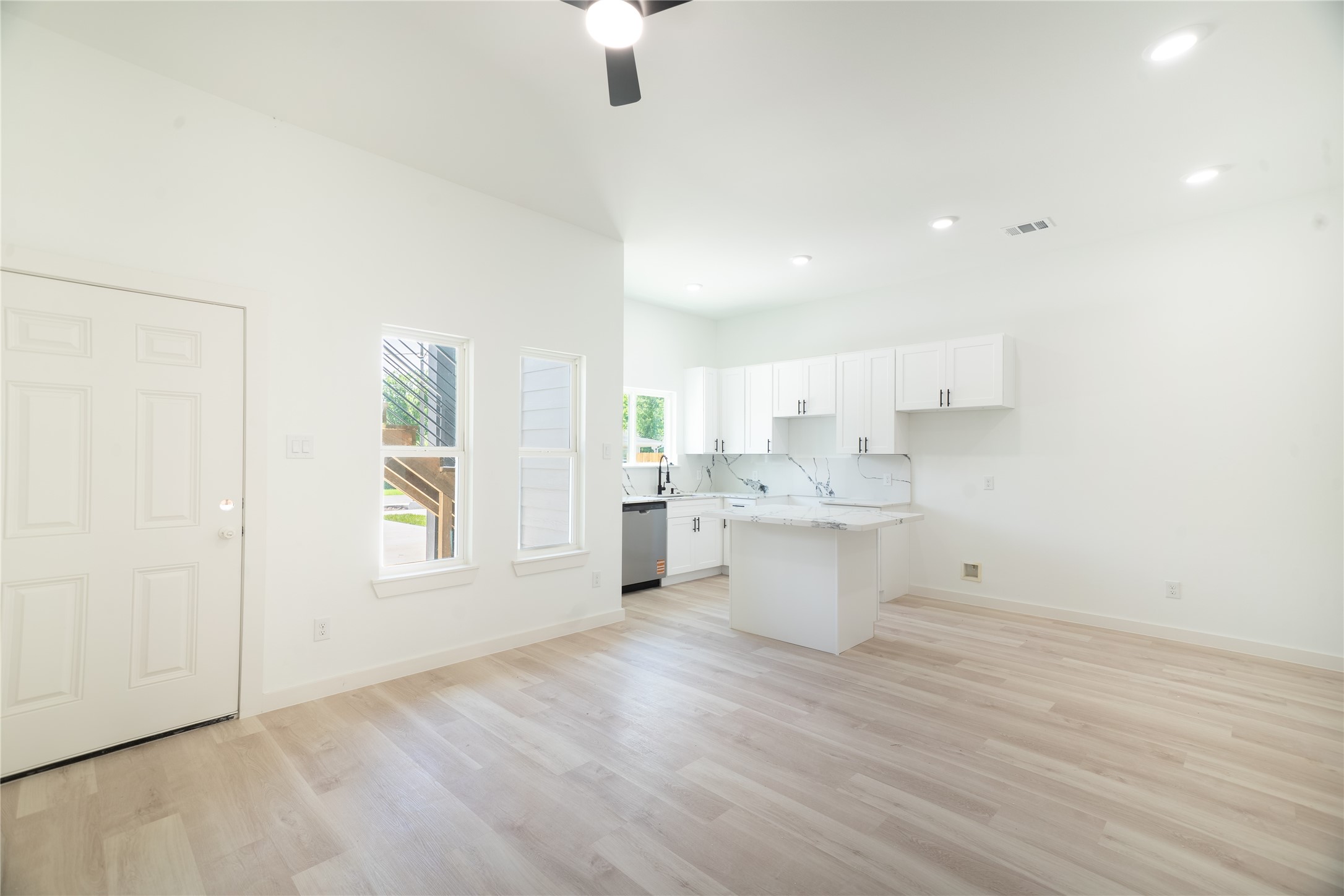 331 Delaware Street Houston, TX 77029 - Photo 4 of 12 a view of a kitchen with wooden floor and a window