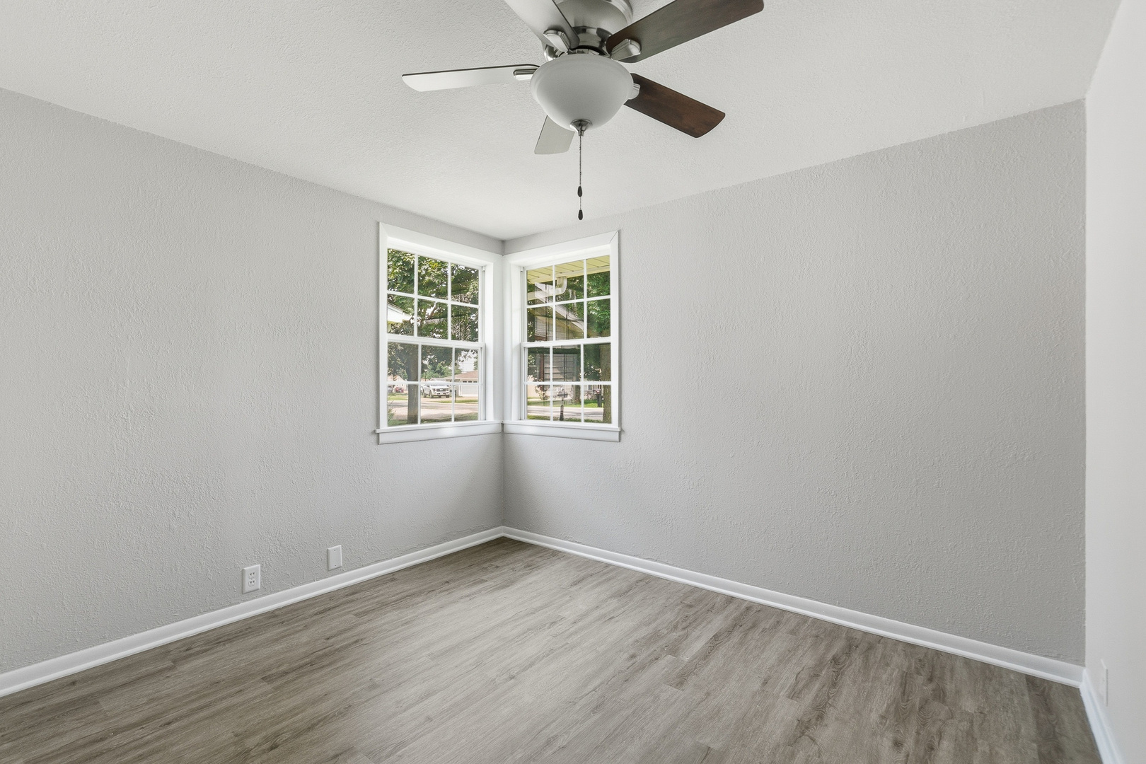 2306 9th Street Silvis, IL 61282 - Photo 28 of 32 a view of an empty room with a window and a ceiling fan