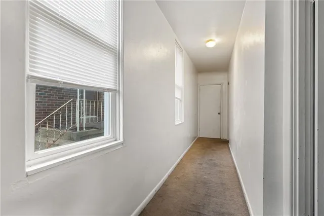 a view of a kitchen with dining area and stainless steel appliances