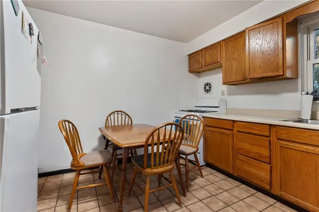 a kitchen with stainless steel appliances a sink stove and cabinets