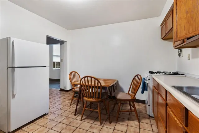 a kitchen with a sink cabinets and window