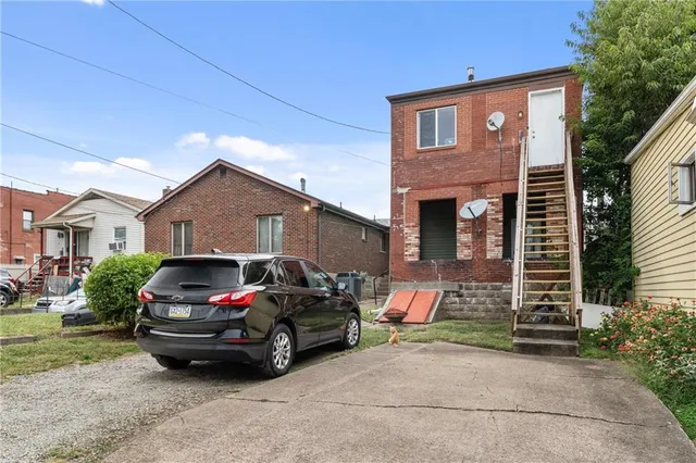 a car parked in front of a house