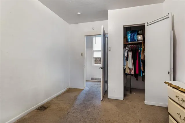 a view of a hallway with closet