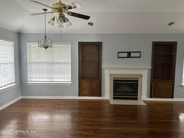 a view of livingroom with furniture and window