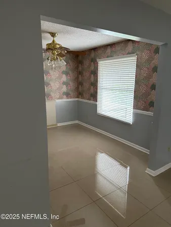 a view of livingroom with furniture and window