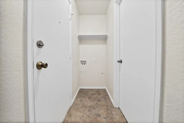 a view of a bathroom from a hallway