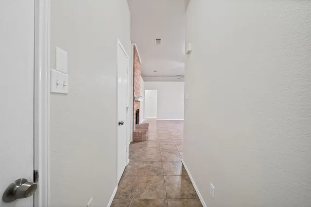 a view of a hallway with a white walls