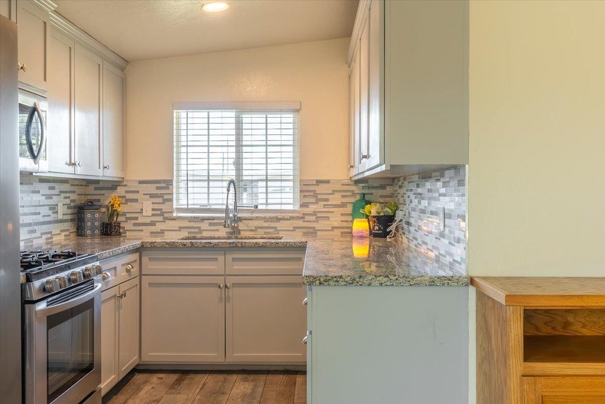 701 Cornell Avenue Salinas, CA 93901 - Photo 13 of 40 a kitchen with stainless steel appliances granite countertop a sink stove and cabinets