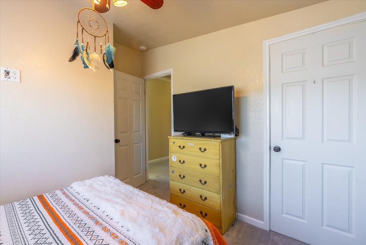 701 Cornell Avenue Salinas, CA 93901 - Photo 21 of 40 a bedroom with a bed and flat screen tv
