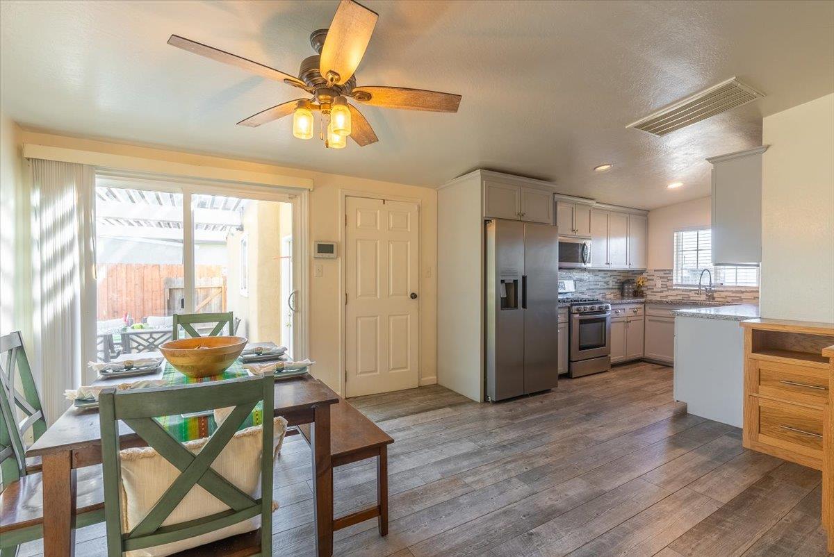 701 Cornell Avenue Salinas, CA 93901 - Photo 10 of 40 a kitchen with a table chairs refrigerator and cabinets