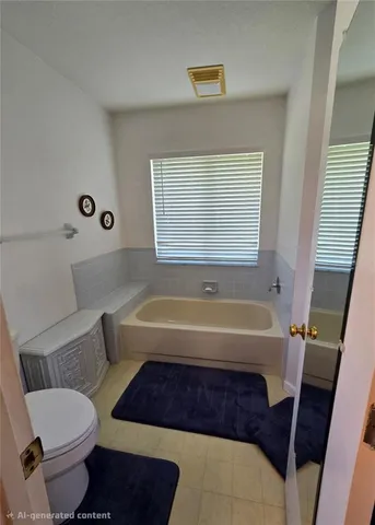 a bathroom with a bathtub and a toilet