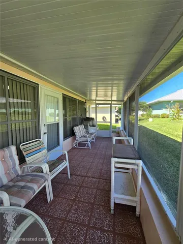 a outdoor space with a couch and a potted plant