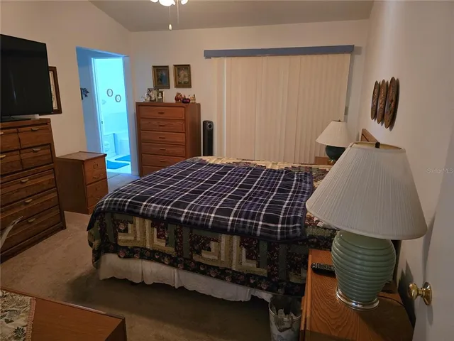 a bedroom with a bed and furniture