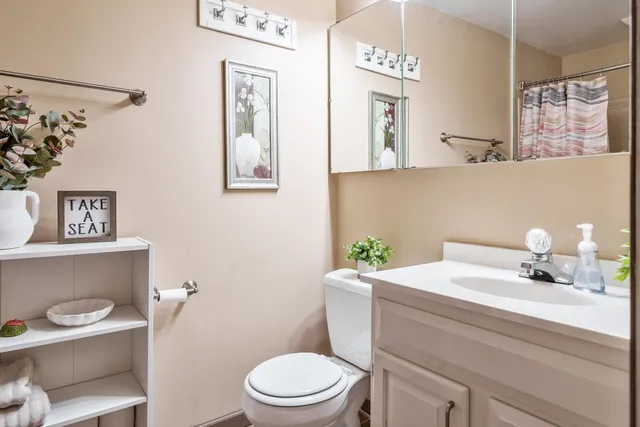 an empty room with windows and cabinet