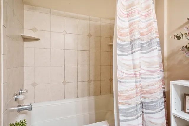 an empty room with closet and cabinet