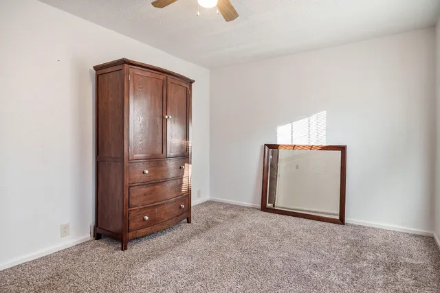 a view of a patio with table and chairs and potted plants