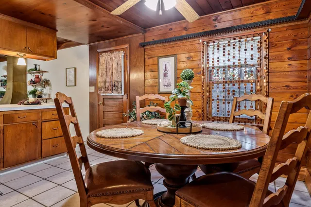 a dining room with furniture and window
