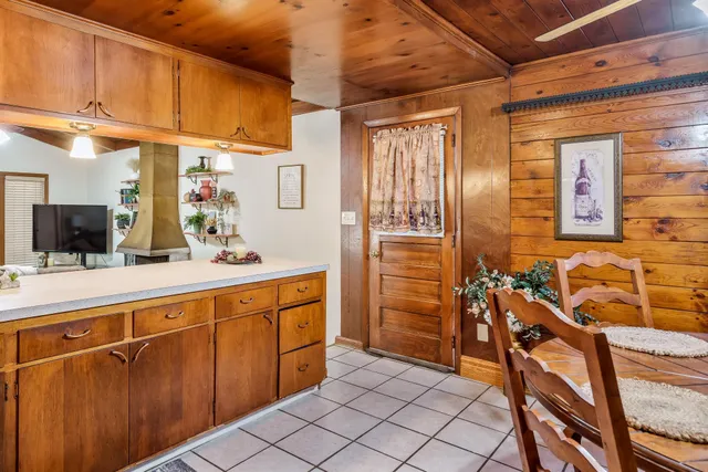a bathroom with a sink a mirror and a shower