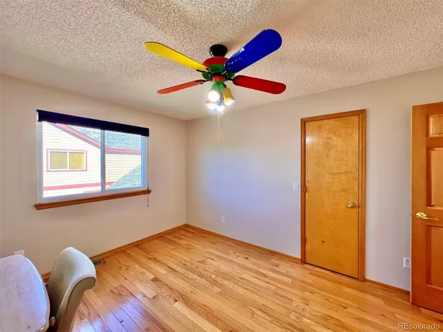 a view of workspace room with wooden floor