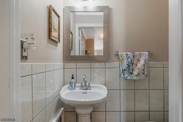 a bathroom with a sink and mirror
