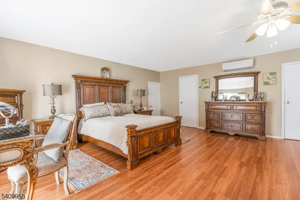 a bedroom with a bed and a cabinets