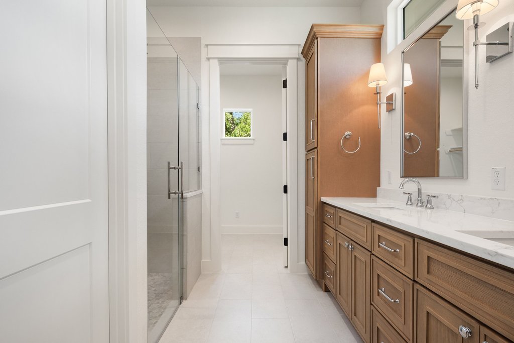 501 Ranchview Drive Johnson City, TX 78636 - Photo 22 of 28 a bathroom with a double vanity sink and a mirror