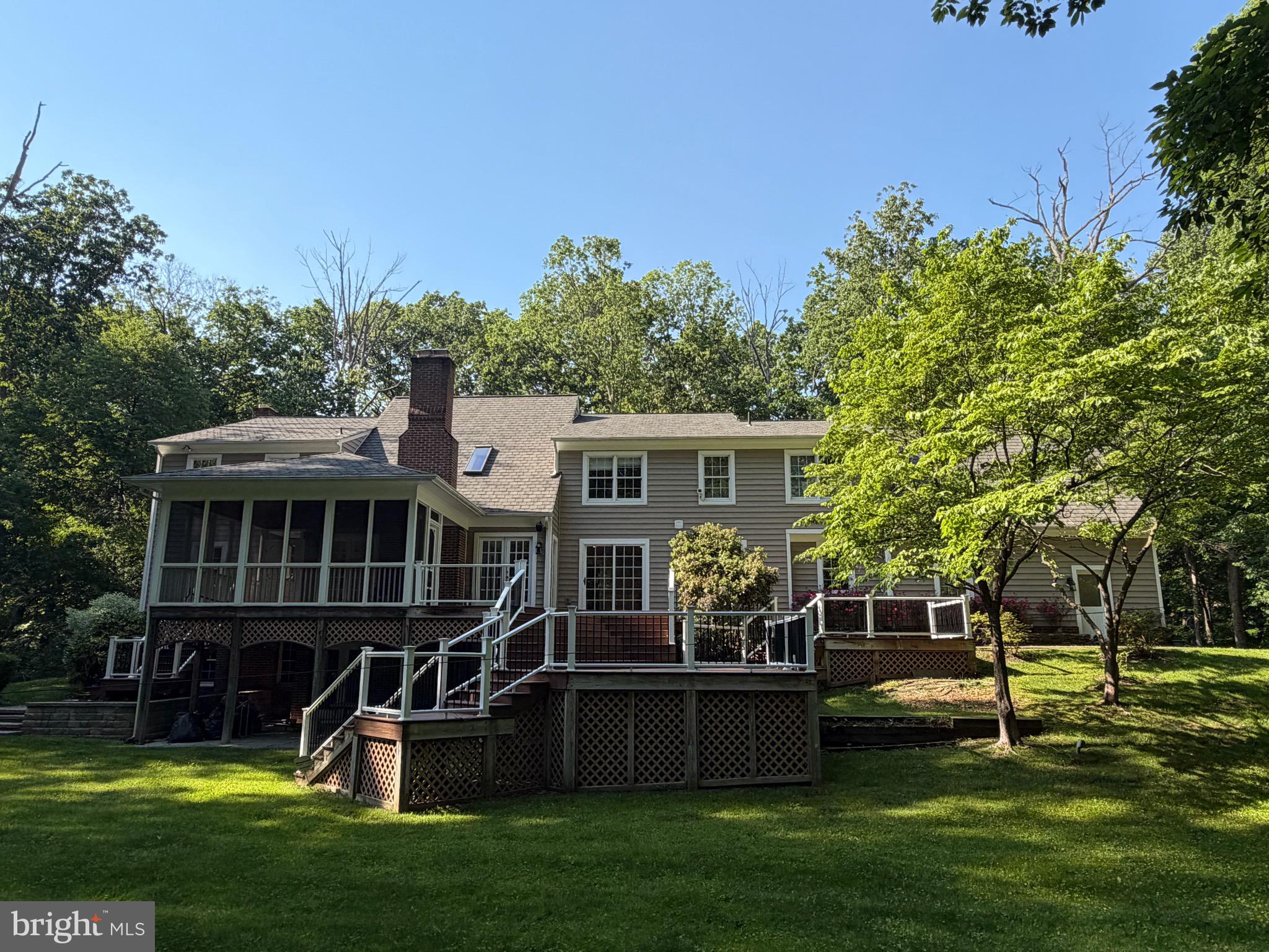7530 Damascus Road Gaithersburg, MD 20882 - Photo 5 of 12 a view of a house with a yard porch and sitting area