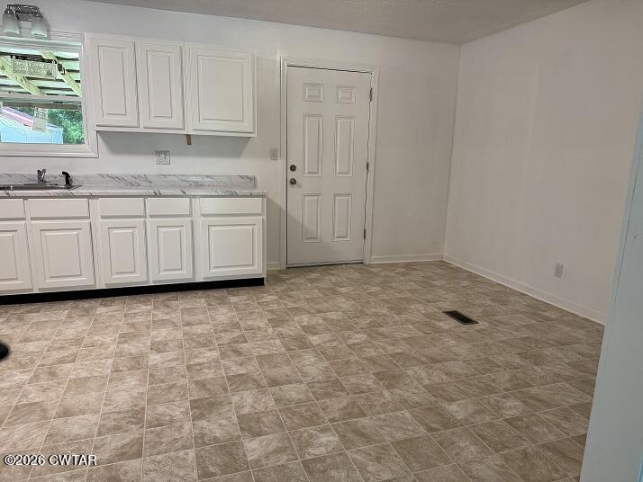 5 Clearview Avenue Trezevant, TN 38258 - Photo 5 of 17 a kitchen with granite countertop white cabinets and a stove