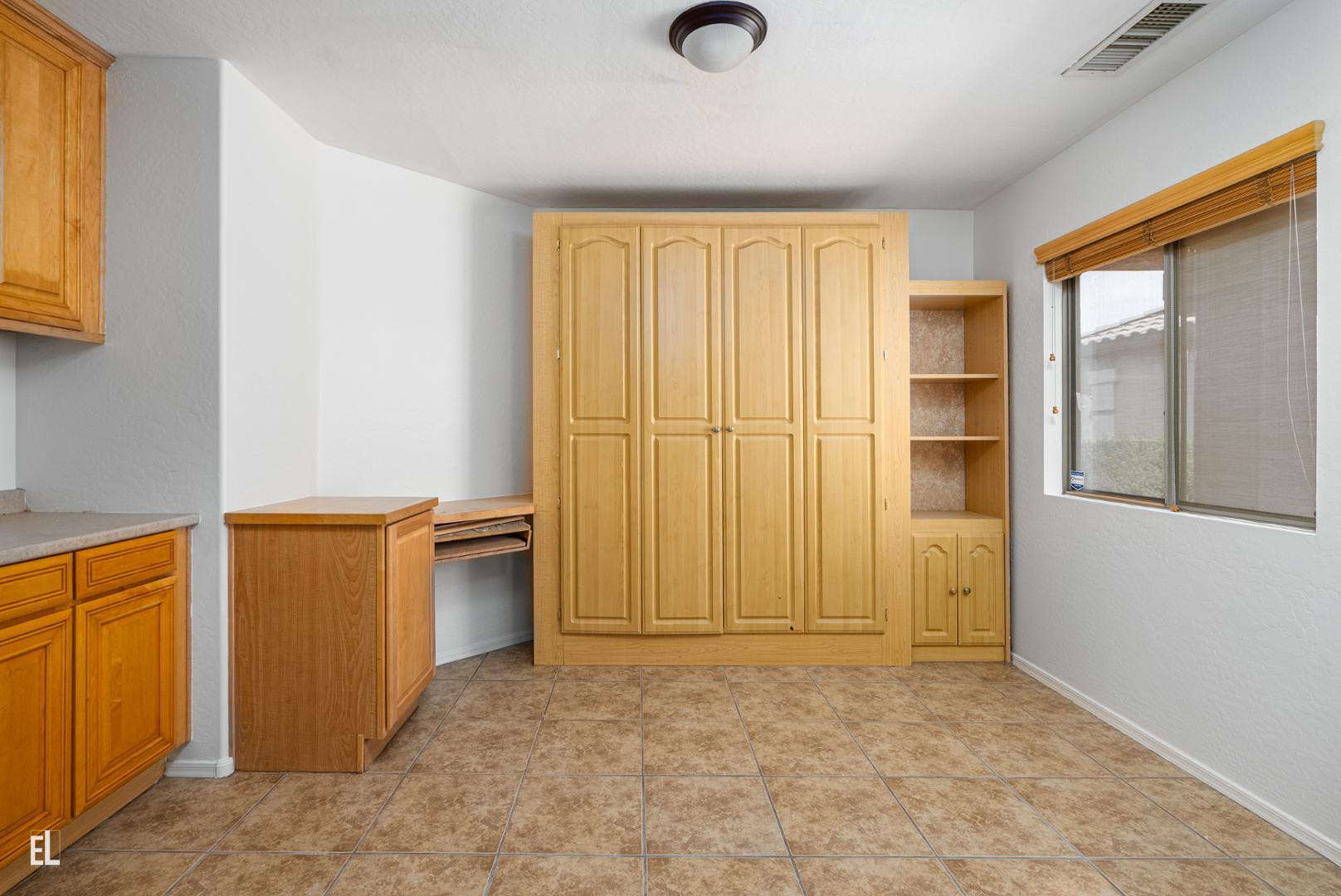 12937 West Bloomfield Road El Mirage, AZ 85335 - Photo 18 of 25 wooden floor in an empty room and a window
