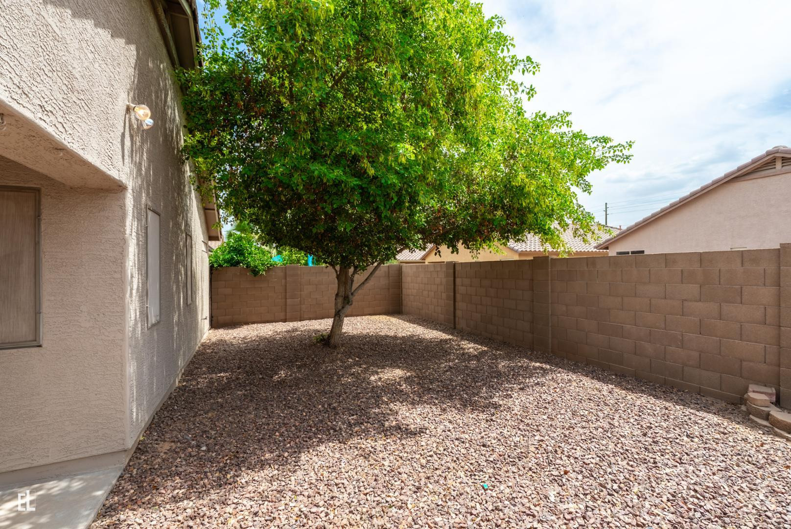 12937 West Bloomfield Road El Mirage, AZ 85335 - Photo 23 of 25 a view of a backyard of a house